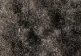 Textura de cabelo afro-texturizado em close, com cachos pequenos e densos