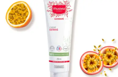 Creme Estrias Mustela Maternité 250 ml em imagem oficial com maracujá ao redor da embalagem