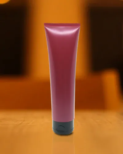Bisnaga plástica rosa com tampa para produto cosmético