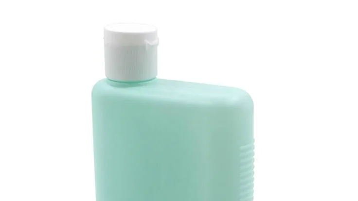Frasco cosmético genérico com tampa branca, usado como exemplo de embalagem para rotulagem.