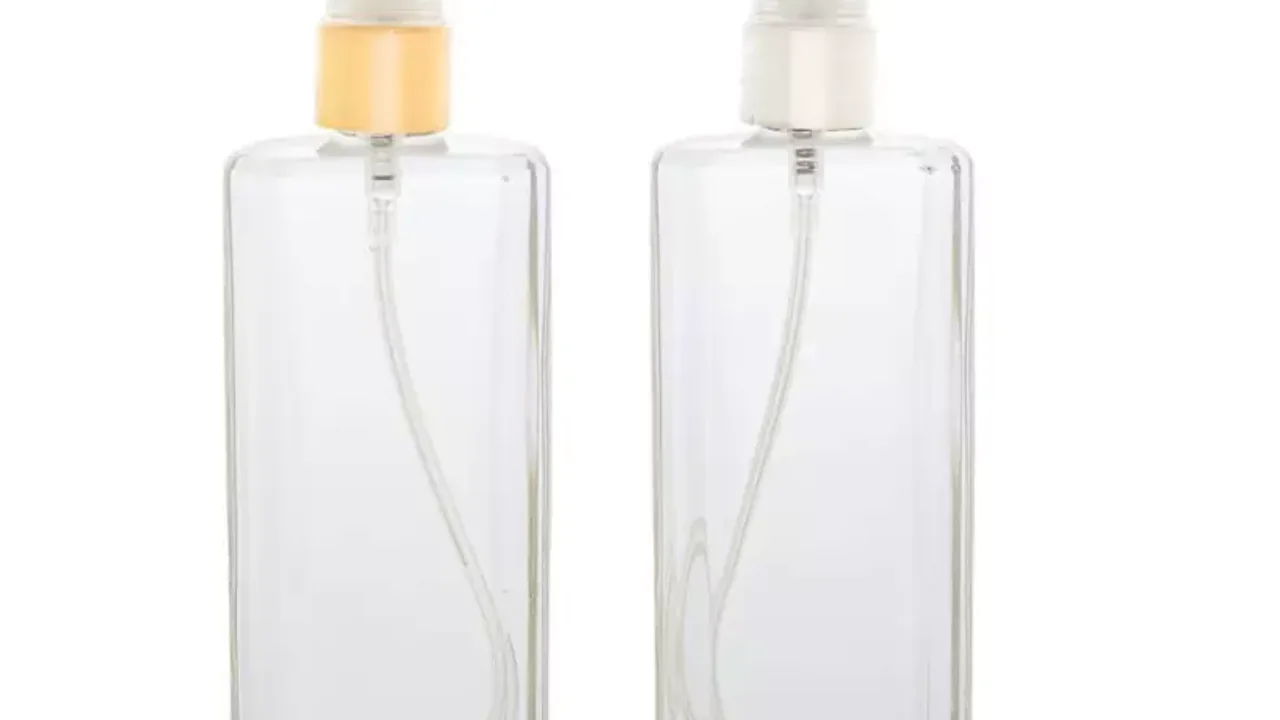 frasco de perfume de vidro transparente com válvula spray dourada e prata