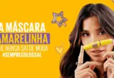 Banner oficial da máscara Maybelline The Colossal Lavável com modelo e embalagem amarela