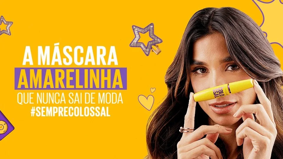 Banner oficial da máscara Maybelline The Colossal Lavável com modelo e embalagem amarela