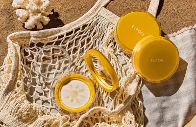 Produtos ELROEL em composição editorial de maquiagem e cuidados pessoais